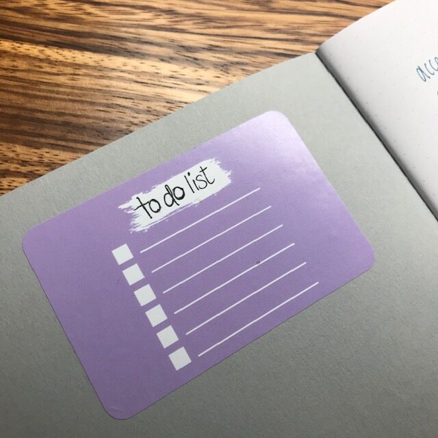 To do list sticker in purple ion a grey page