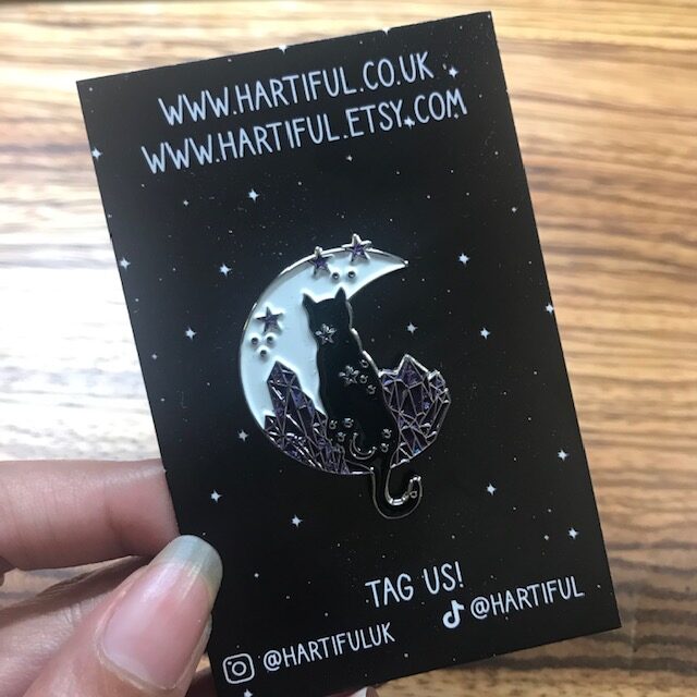 Celestial Birthstone Crystal Inspired Moon Cat Enamel Pins - Purple on a black backing card