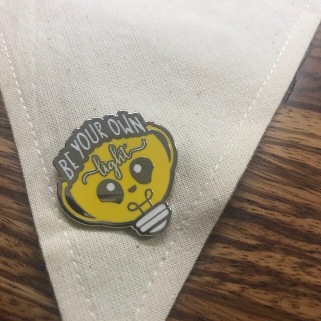 corner of Swallowtail banner with yellow pin on it