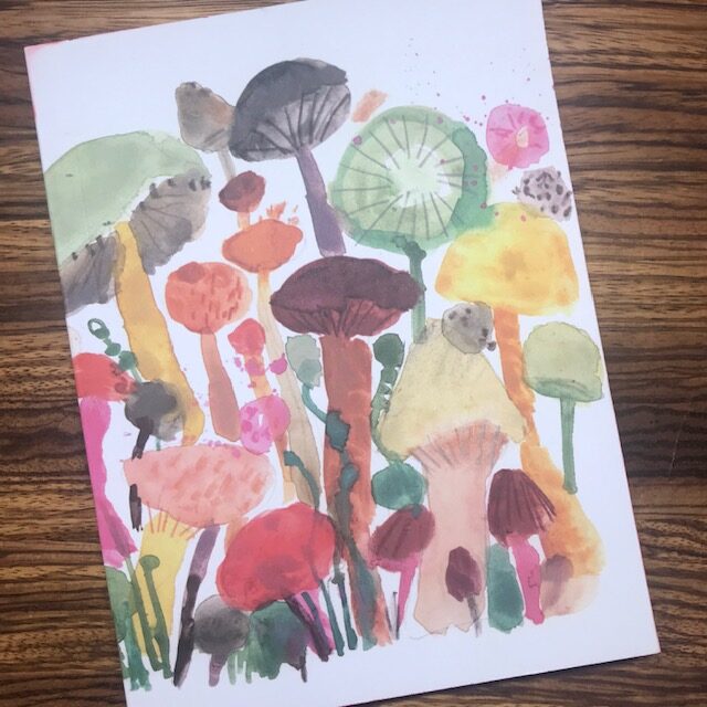 notebook with colourful mushrooms