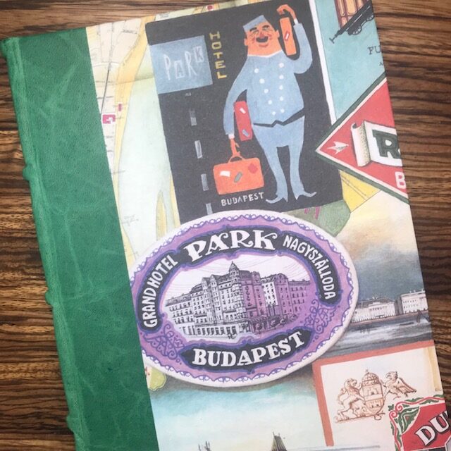 Close up of cover of Bomo Art notebook with travel images