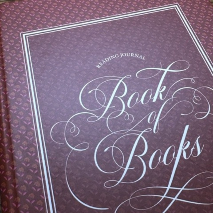 reading journal with red cover with the words book of books