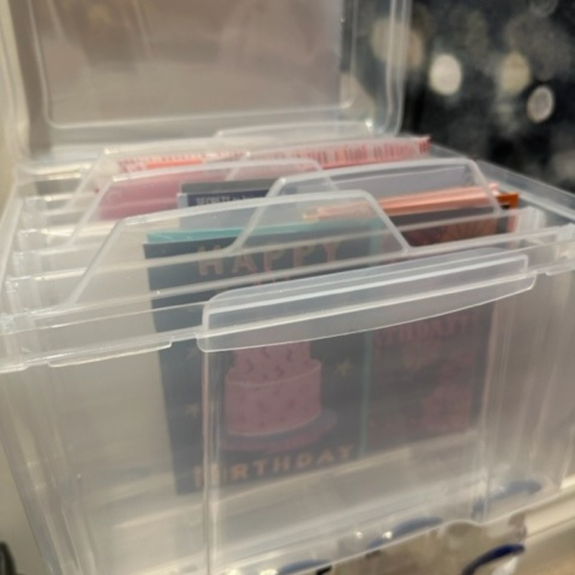 plastic box used a storage for greeting cards with plastic dividers