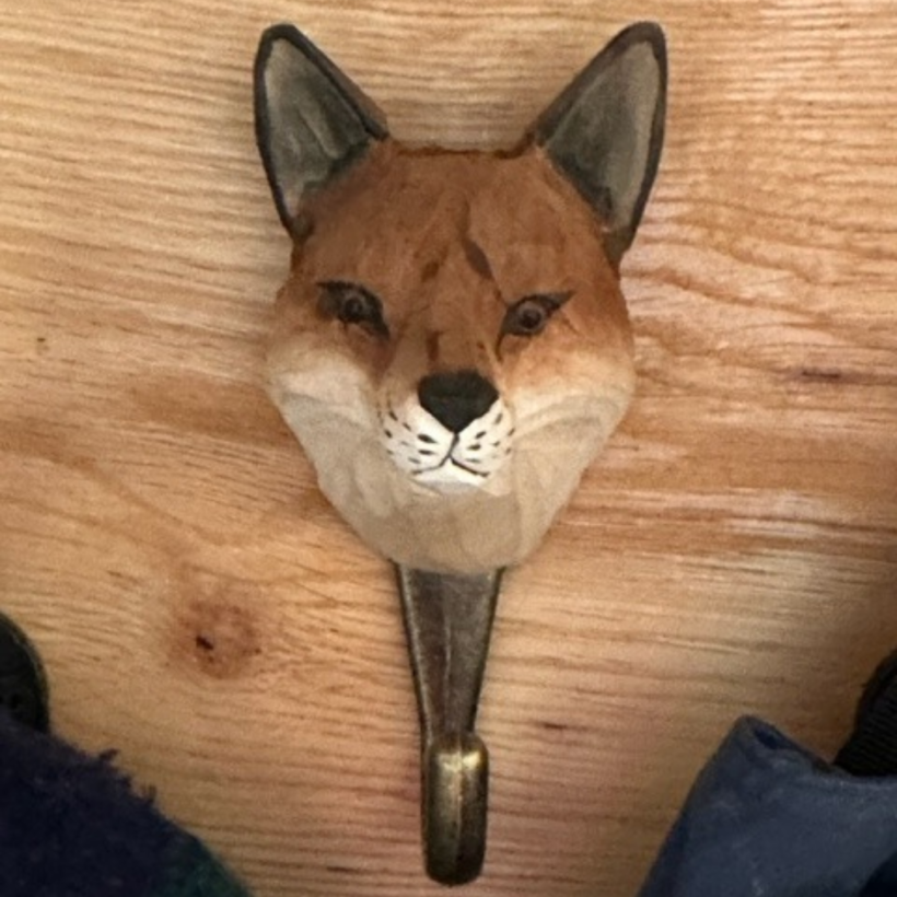 Hand carved red fox hook on wooden board