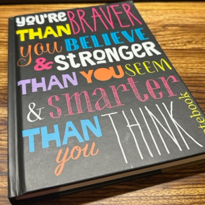 You are braver than you believe stronger than you seem & smarter than you think on a black notebook