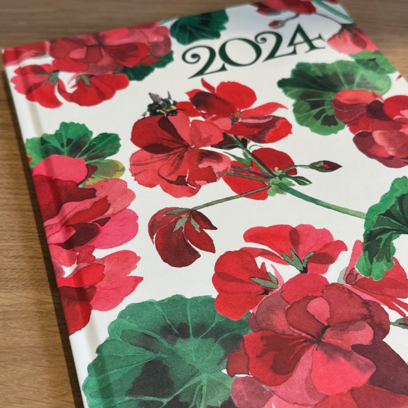 2024 diary with bright red Geraniums on the front cover.