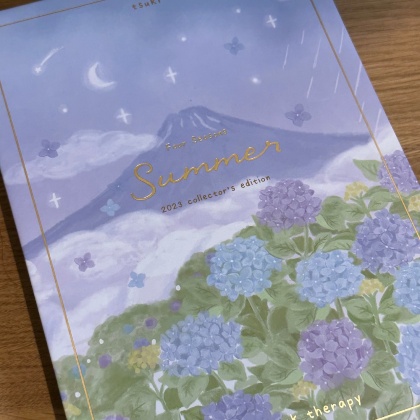 Tsuki Four Seasons: Summer Collector’s Edition 2023 Bullet Journal box with image of mount Fuji and hydrangea blooms in blue and purple on the front.