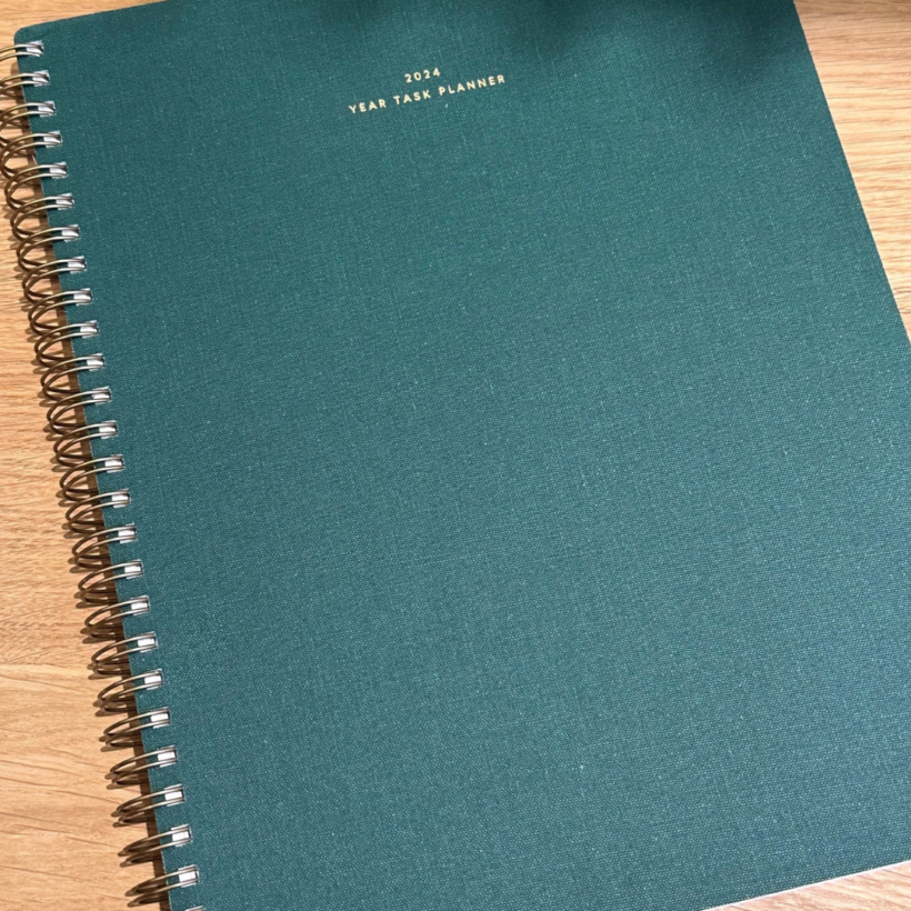 2024 year task planner from appointed in hunter green with title embossed in gold foil on the front.