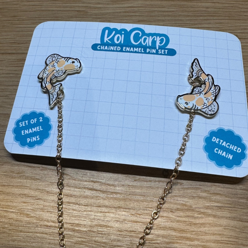 Koi Golden/Orange Carp pin set with two pins, a detachable chain